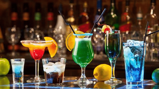 Image of a variety of drinks placed on a table at Coorg Jungle Camp Backwater Resort, Kushalnagar.