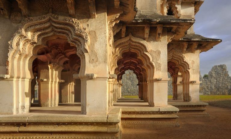 Lotus Mahal at Hampi, arched stone structure with pillars.