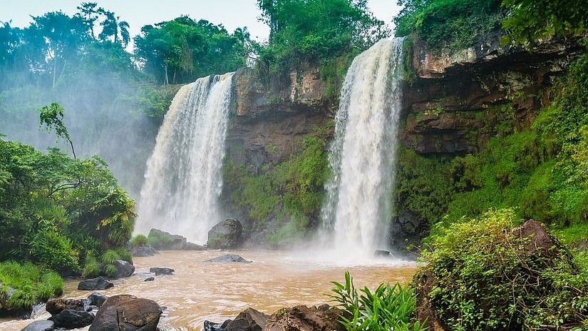 Majestic twin waterfalls in a lush green forest