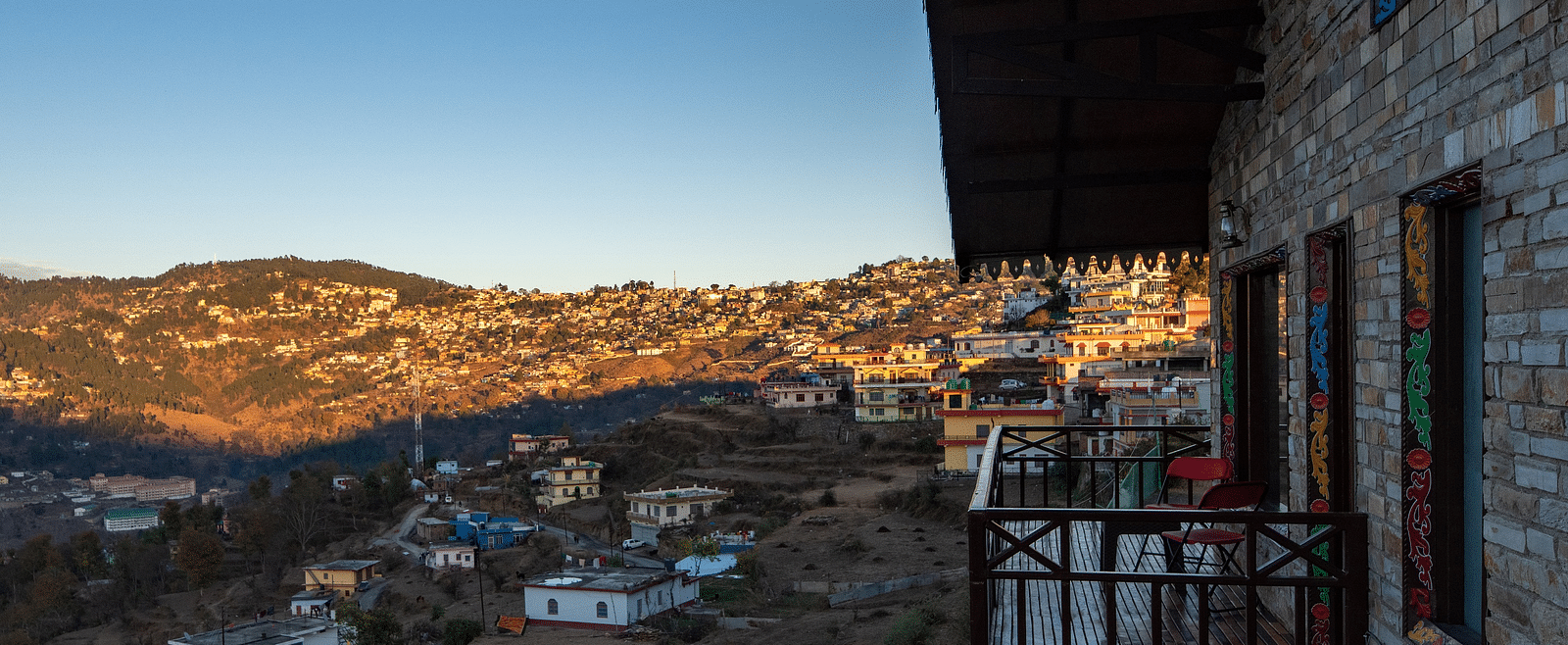 A charming homestay surrounded by lush greenery and set against the backdrop of rolling hills and blue skies. - Blusalzz Homes The Himalayan Bungalow, Almora