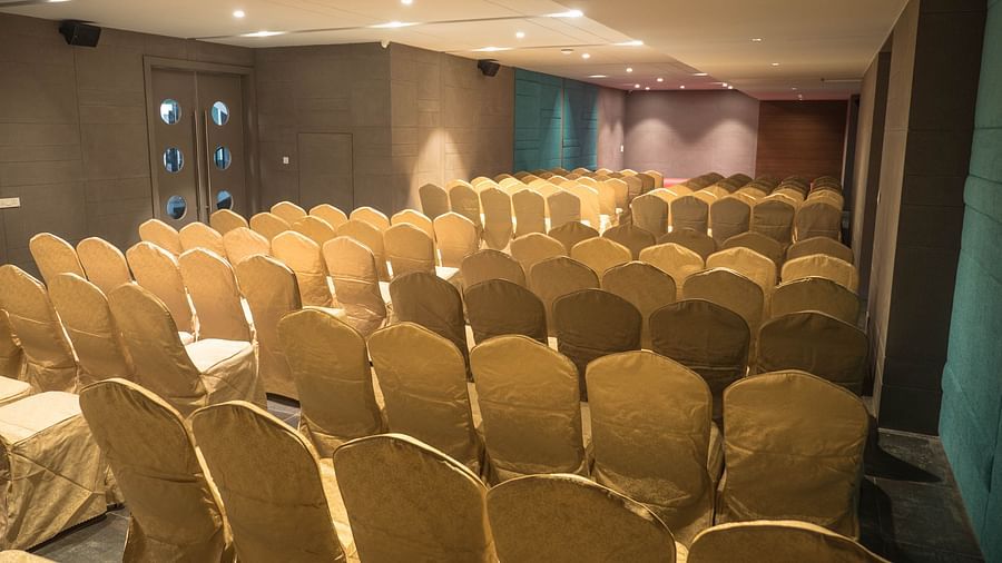 event halls with yellow chairs at Cholaa Dynasty, Kumbakonam