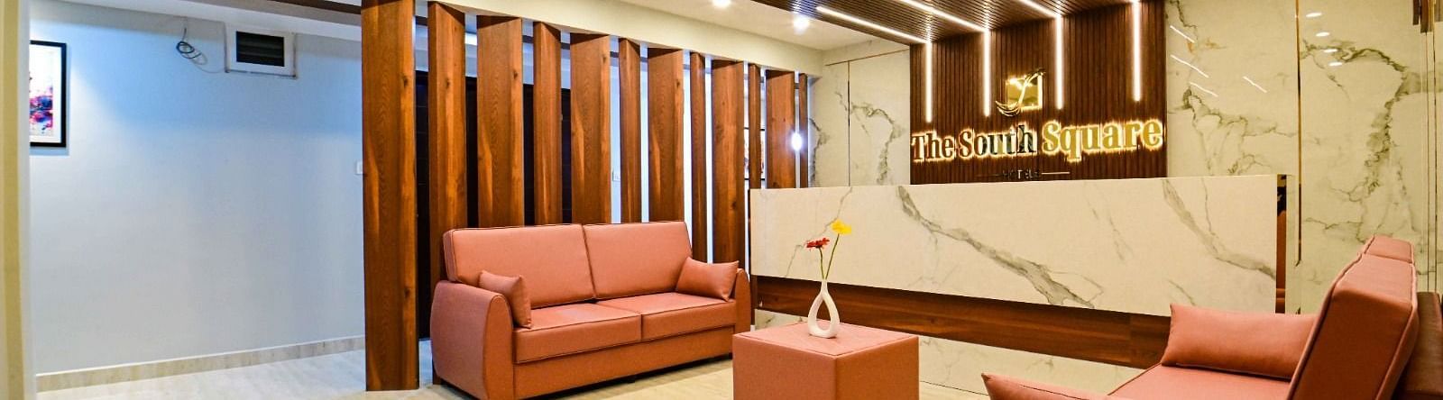 lobby area with comfortable seating of  South Square Hotel, Bengaluru