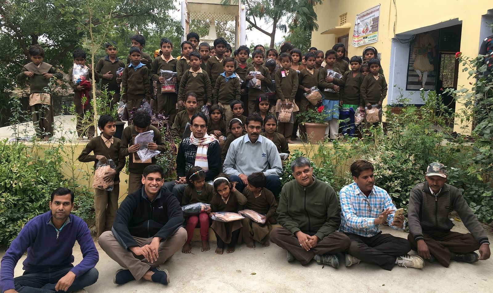 an group photo featuring the Founders of Dev Shree, deogarh at a school for during a CSR activity