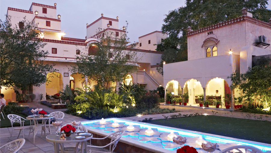 Seating arrangements in the courtyard next to the fountain at anada restaurant at Mandawa Haveli, Jaipur
