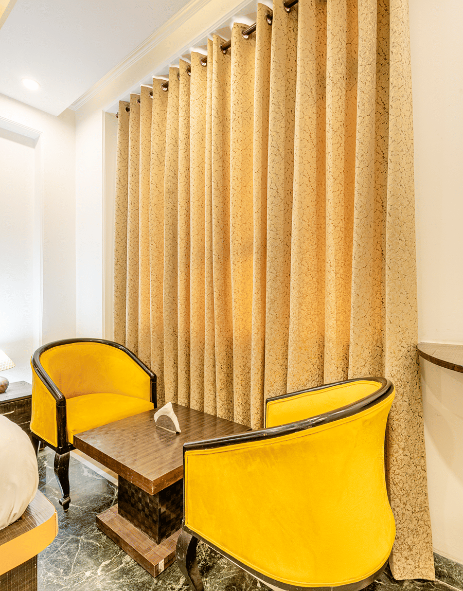 Two facing chairs in the superior double or twin room at Lime Tree Hotels and Banquet Hall Near Huda Metro, Gurgaon