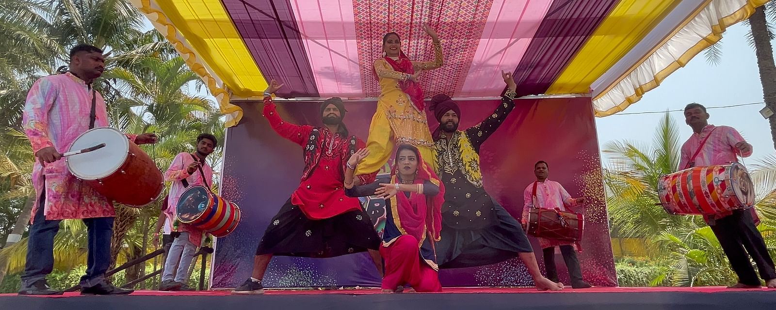 A group of people presenting the Pubjabi culture on a stage | Diamond Parks, Pune - Wedding Venues in Pune
