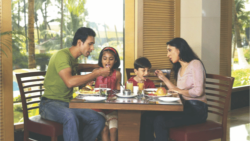 A family enjoying a meal at a restaurant.