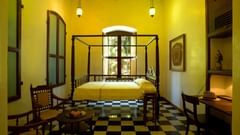 Le Dupleix - antique french furniture high wooden ceiling large windows send out a warm lived in feel a