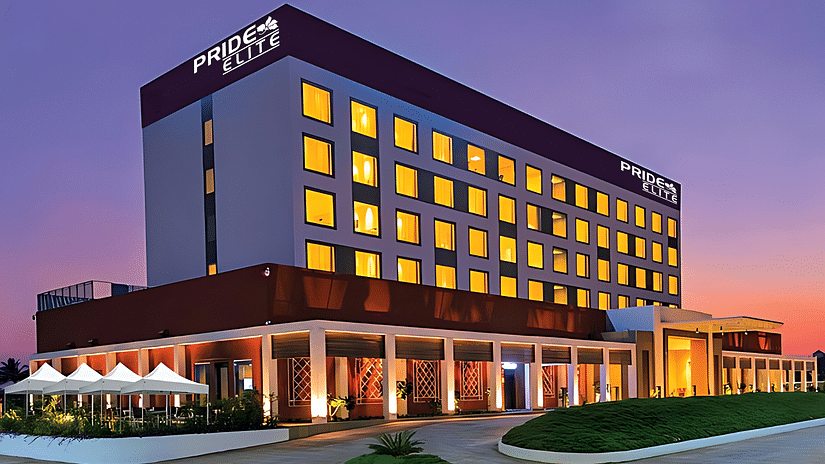 A facade image of the Pride Elite Phaltan with a dusky sky in the background