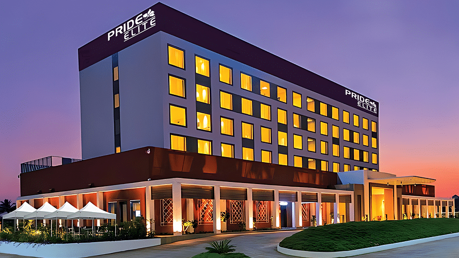 A facade image of the Pride Elite Phaltan with a dusky sky in the background