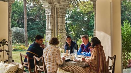 image of a group of guests feasting at an open dining space at dev shree deogarh