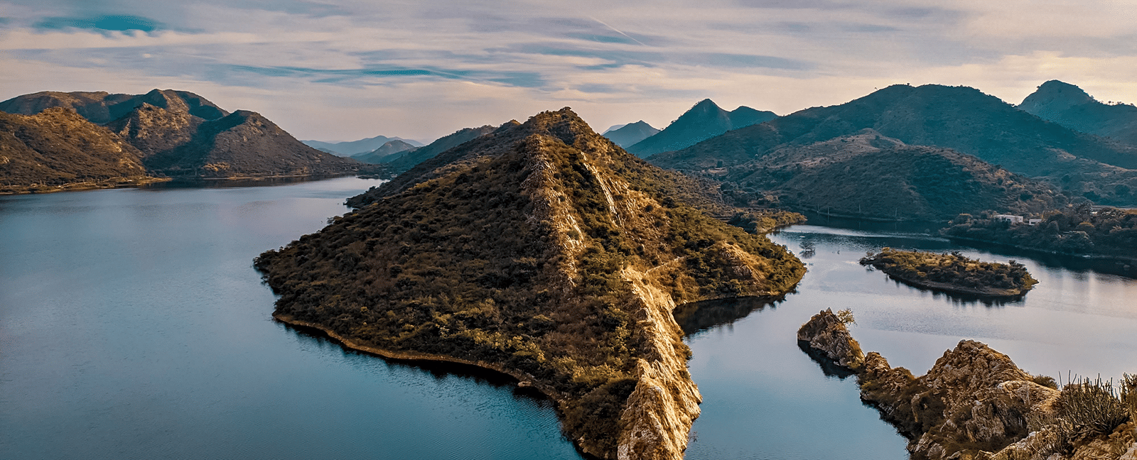 Aerial view of Bahubali Hills jutting into the tranquil waters of Badi Lake.