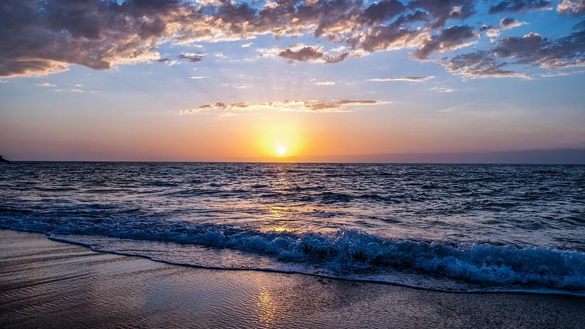 Sunset at a beach on a cloudy day