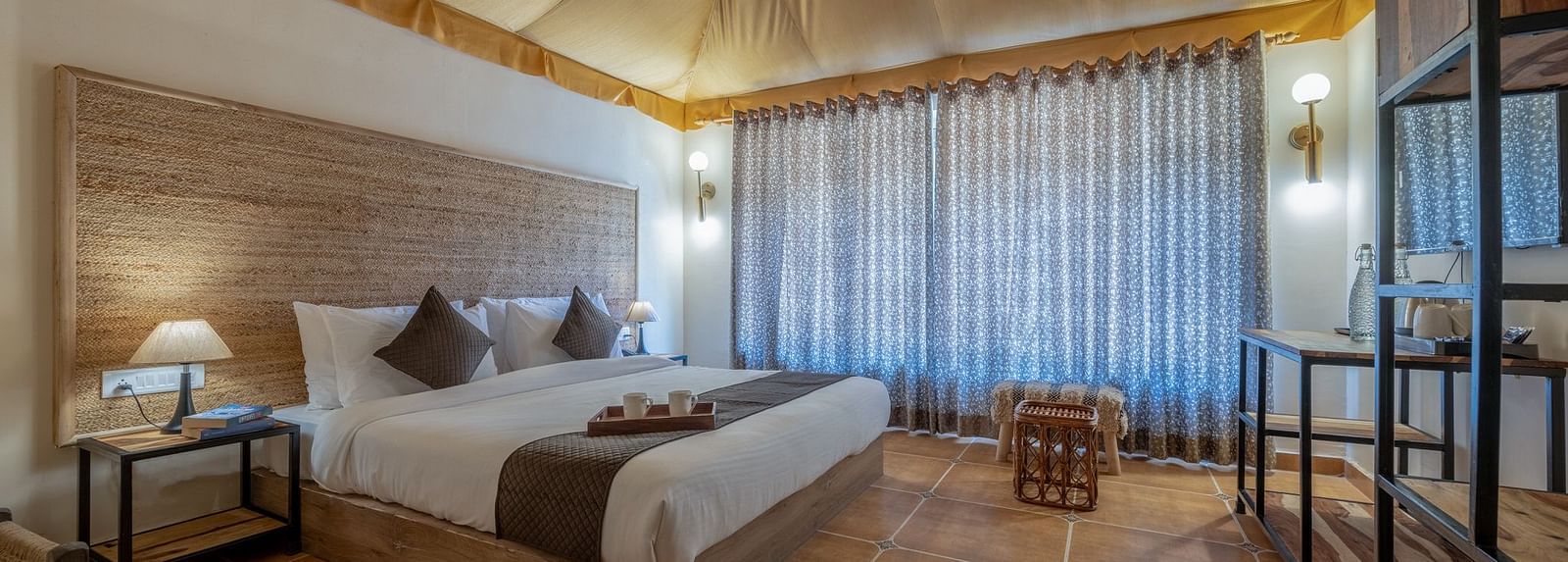 Side view of an accommodation with a bed and a tented ceiling at Valley by Grassfield.