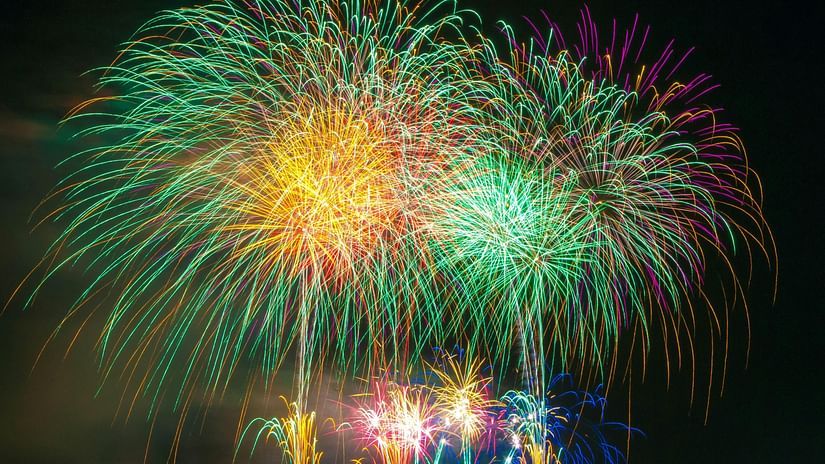 Fireworks light up the night sky, creating a vibrant display against the darkness.