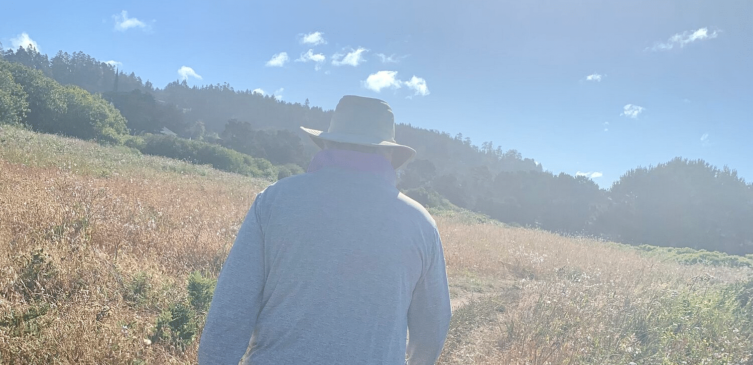 A person walking through a trail road