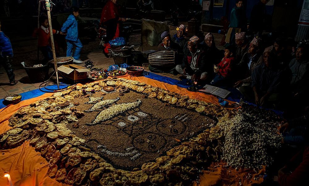 View of Sakimana punhu, Bhaktapur with people gathered around