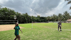 Open lawn at Fantasy Golf Resort, Bangalore perfect for outdoor sports and leisure activities.