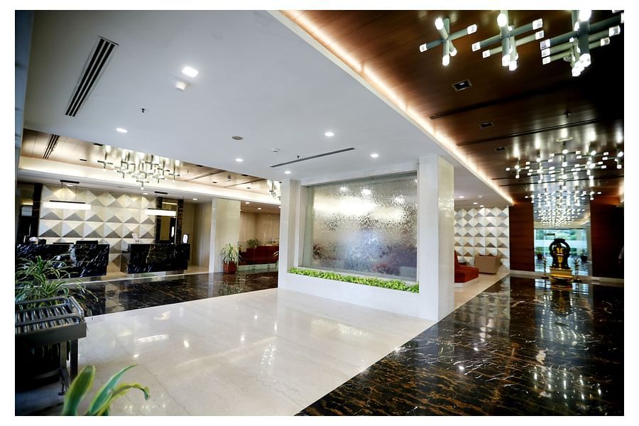 alt-text sofa seats and chandeliers occupying the lobby area