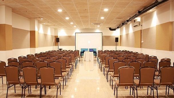 A back view of chairs on a closed hall, arranged in a classroom setting | Hotel Mumbai House, Andheri East