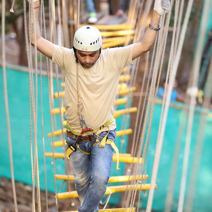 Skywalk - Sajan - walking above yellow thin sttrips in zig zag shape at an height.