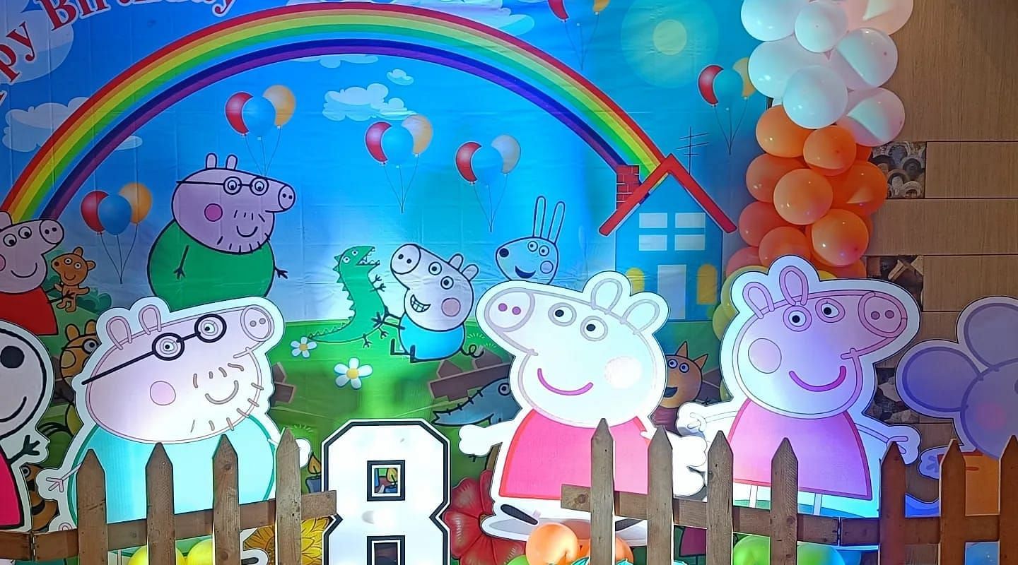Image of a corner decorated with ballons and peppa pig cut outs at at The Oriental Residency