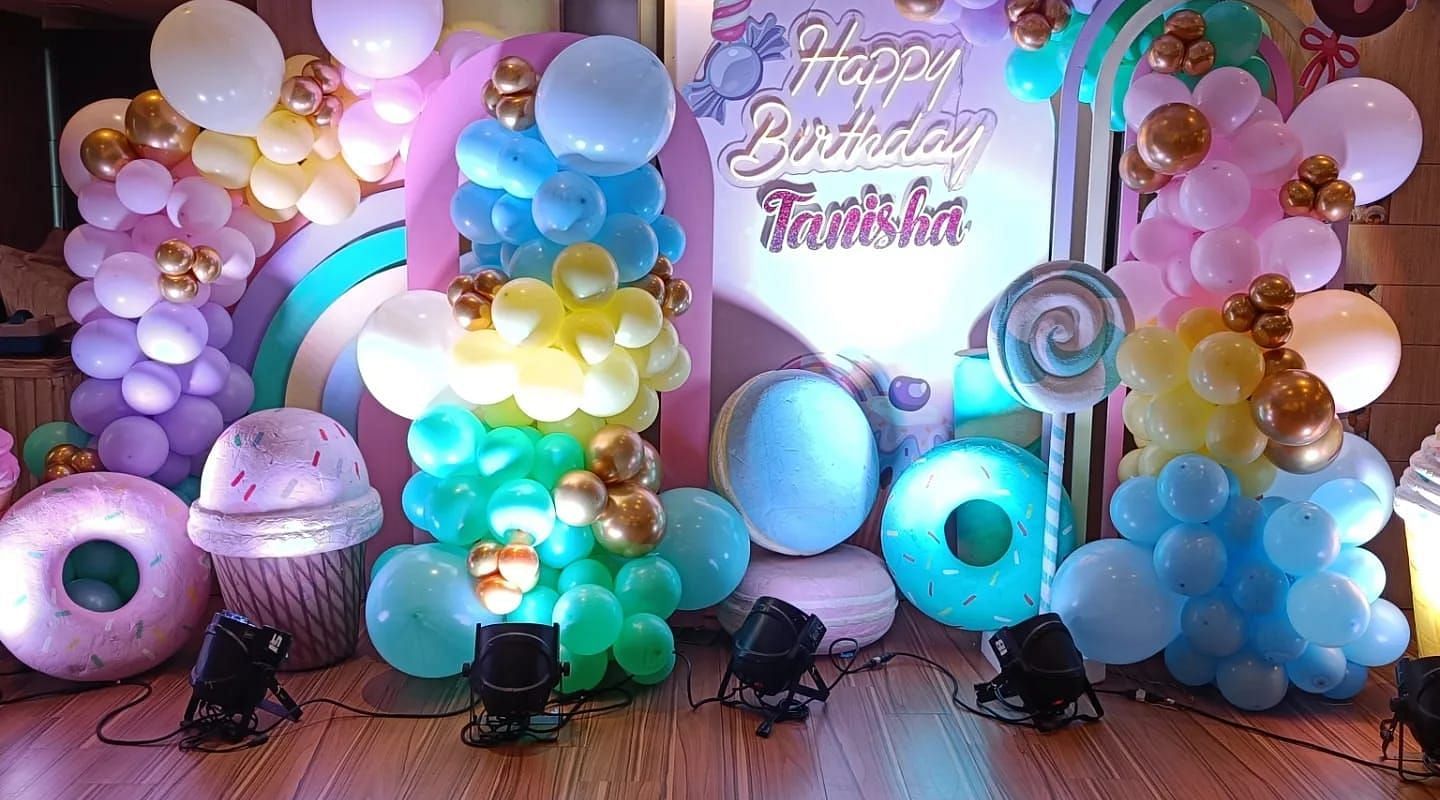 Image of a stage decorated with ballons and lights at The Oriental Residency