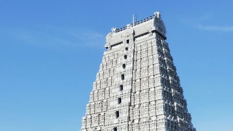 Stunning view of the historic Meenakshi Amman Temple gopuram reflected in the temple tank.