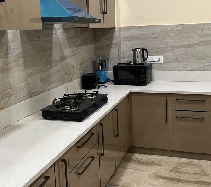 Kitchen area at Lime Tree 3BHK Serviced Apartments, DLF Phase - 5 Gurgaon