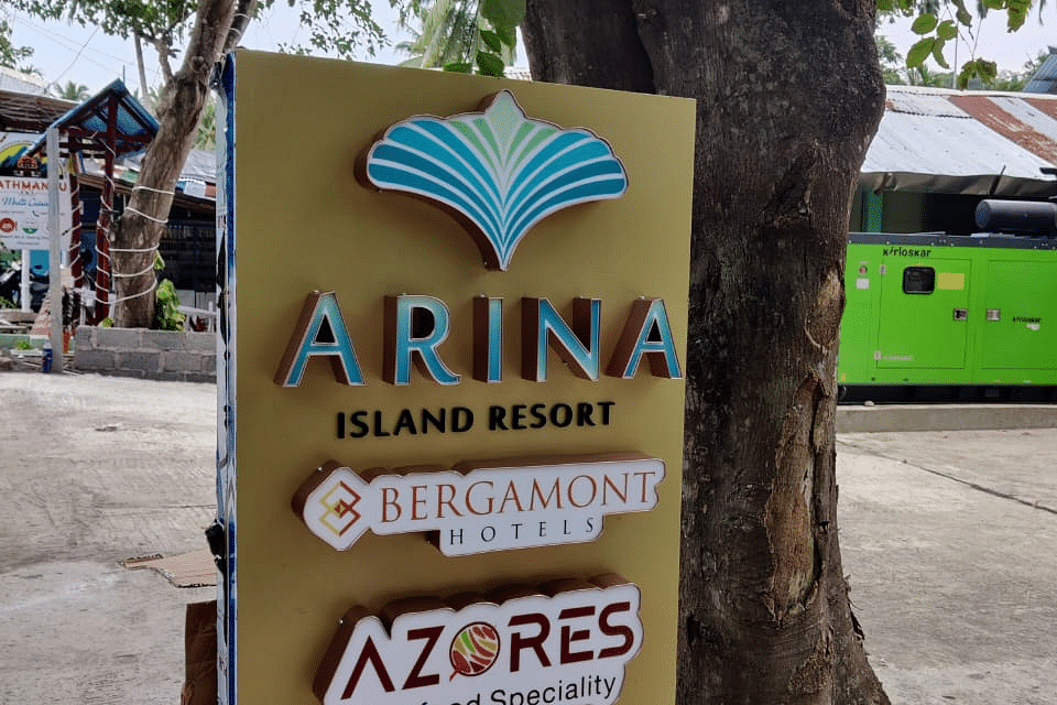 Shot of a display board in the resort that states the name of the dining section | Arina Island Resort