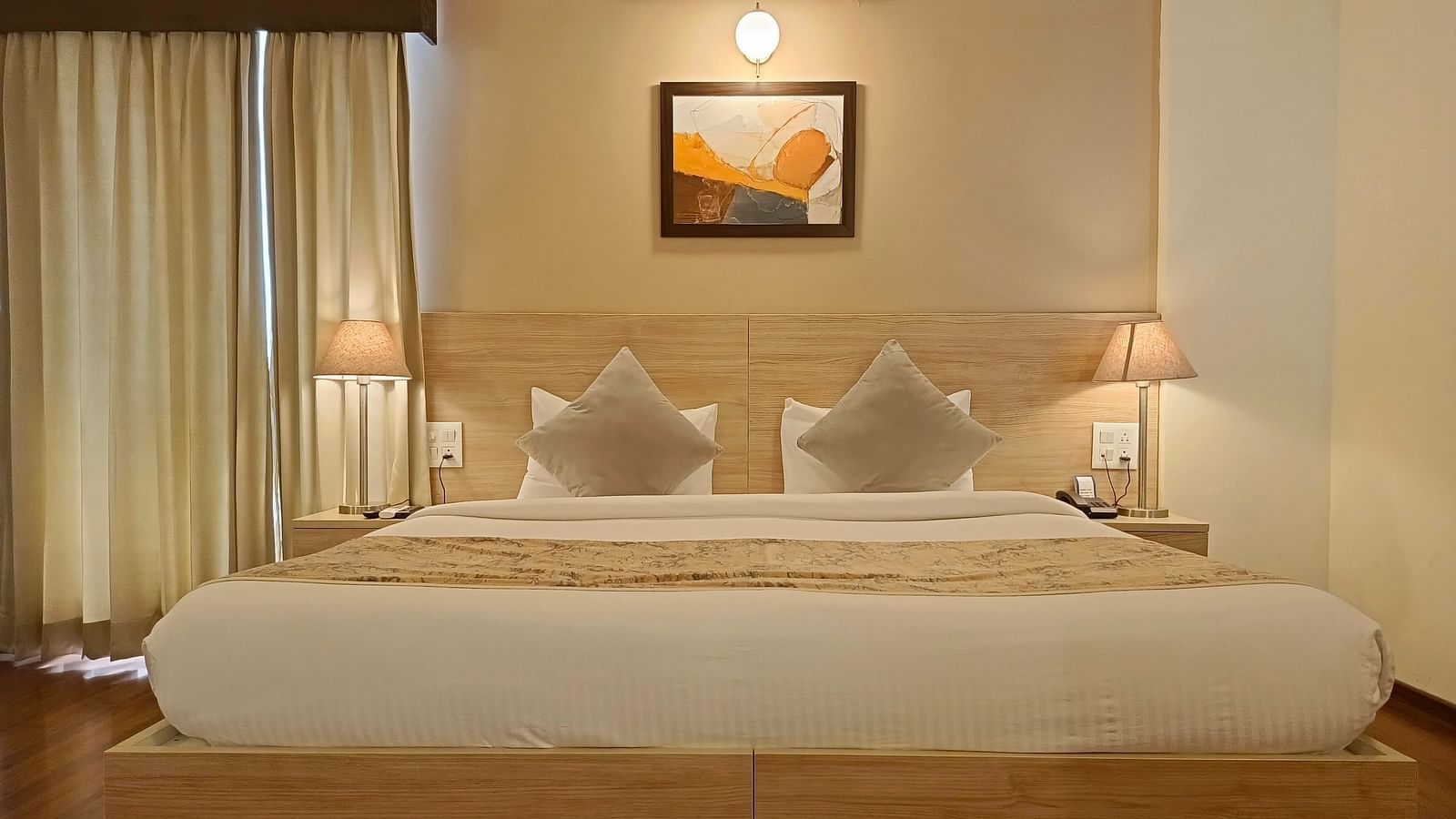 A close up shot of the double bed inside premium studio - Starlit Suites, Shirdi