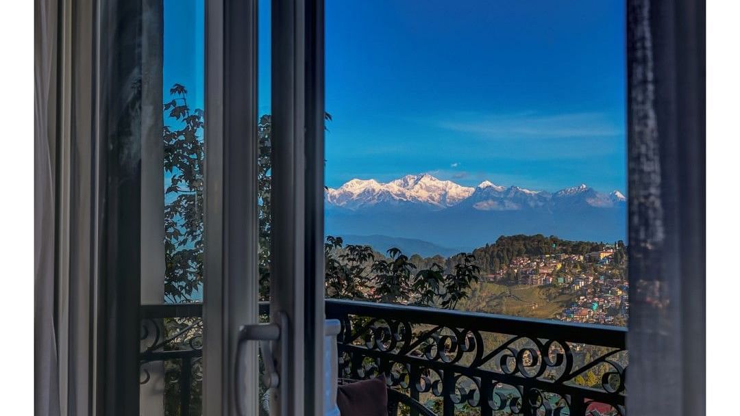 Shot of the private balcony overlooking the surroundings with chairs and table.