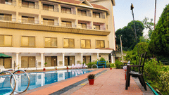 swimming pool in the side and the facade of VITS Kamats Resort, Silvassa