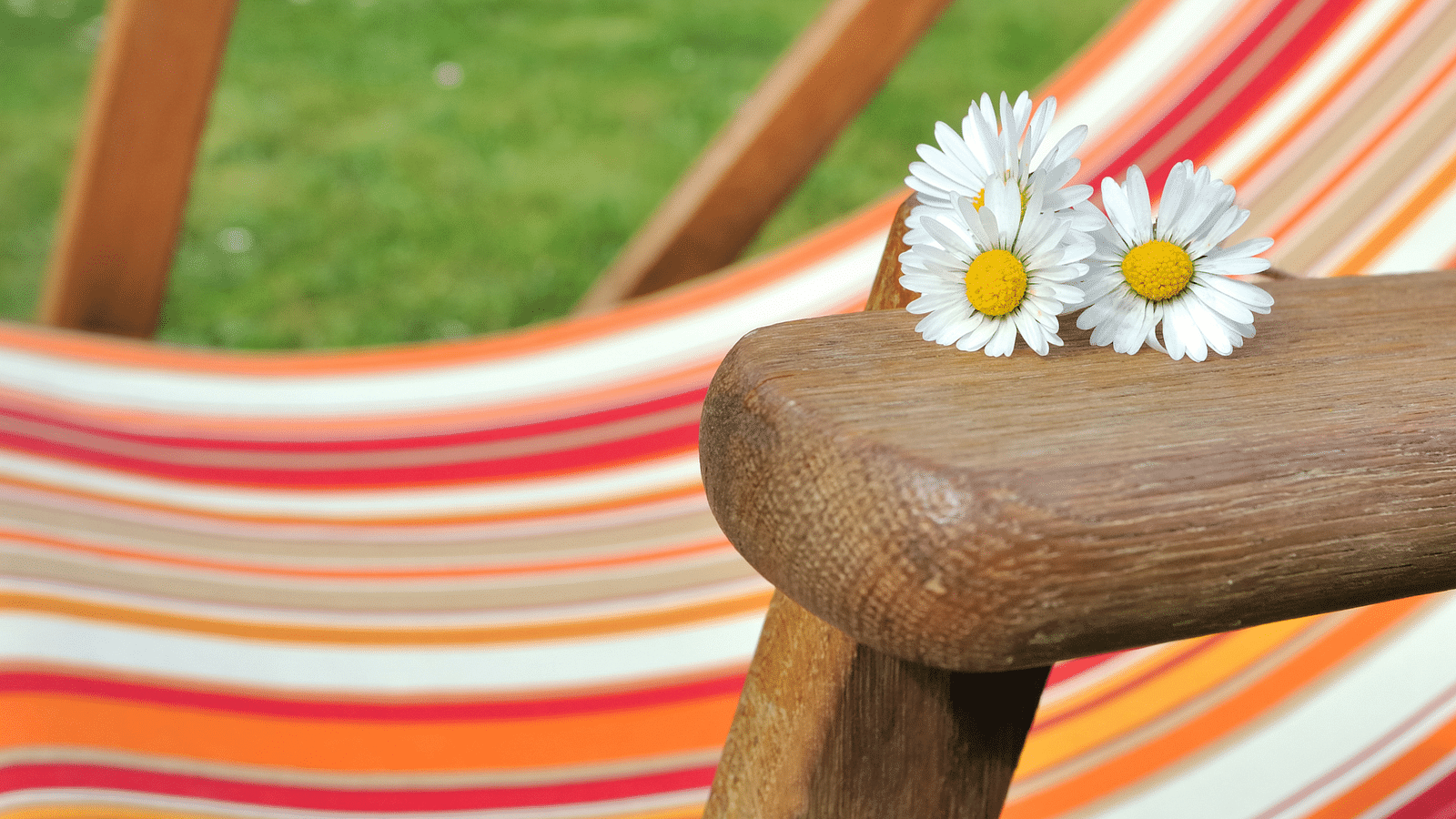 an image of flowers on the handle of a chair