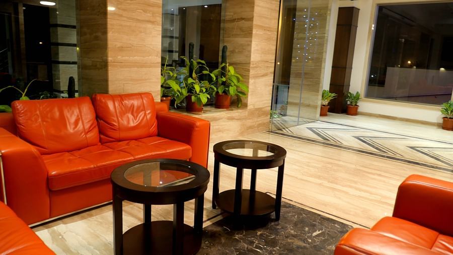 lobby with comfortable chairs and warm lightining of ASR Parklane, Hosur