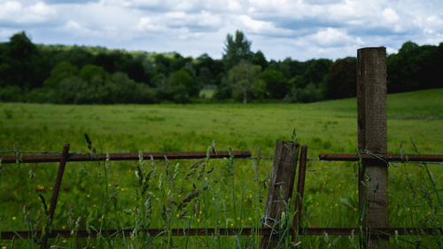 a wooden fence around a field
