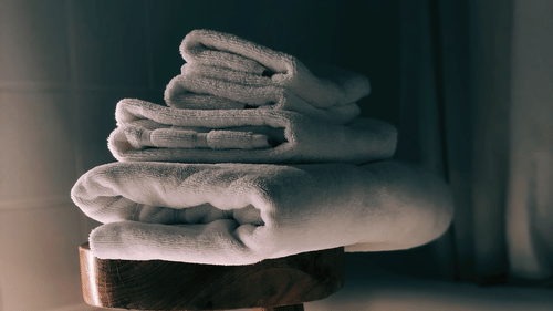 Abad Green Forest - image of towels on a stool