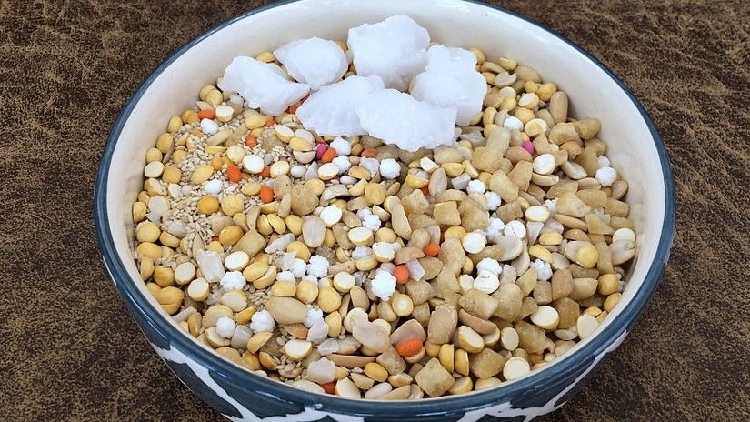 Ellu bella made with sesame seeds jaggery and ground nut served on a dish
