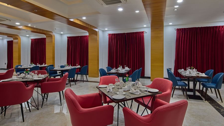 the indoor seating space at the restaurant - Golden Tulip, Tirupati  3