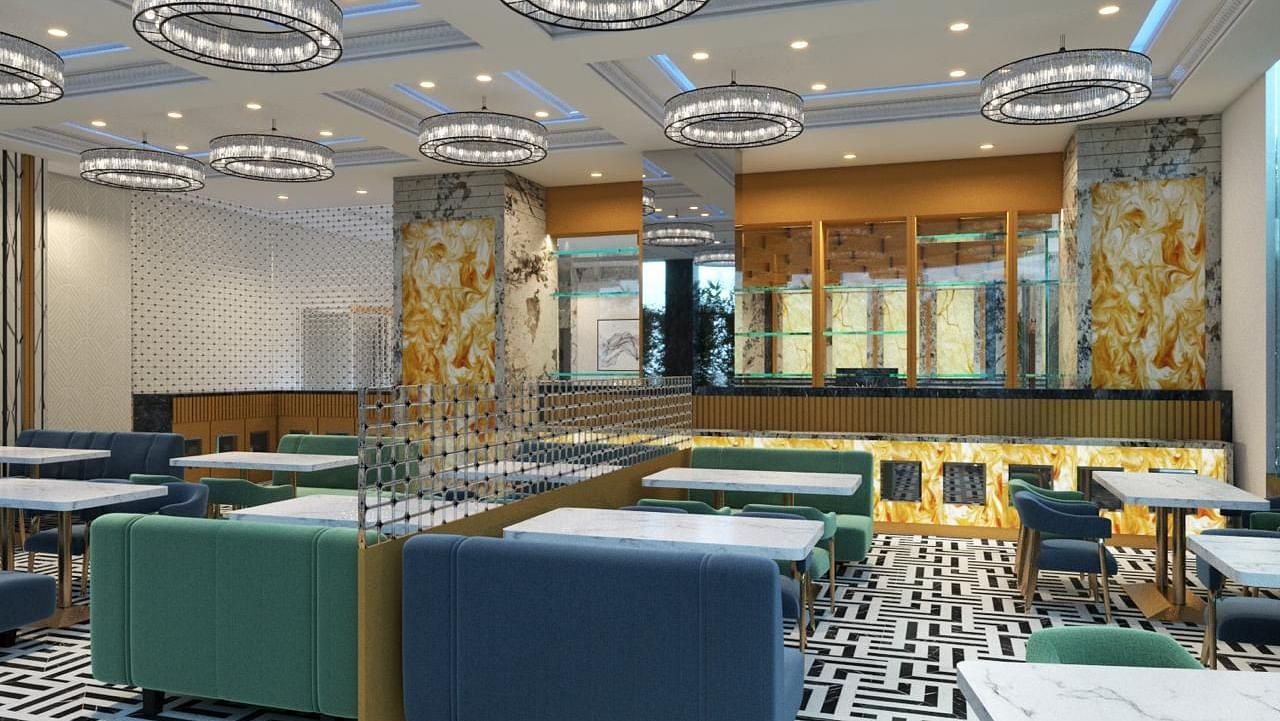 Side view of a restaurant interior featuring cushioned chairs at Hotel Mumbai House, Vashi.