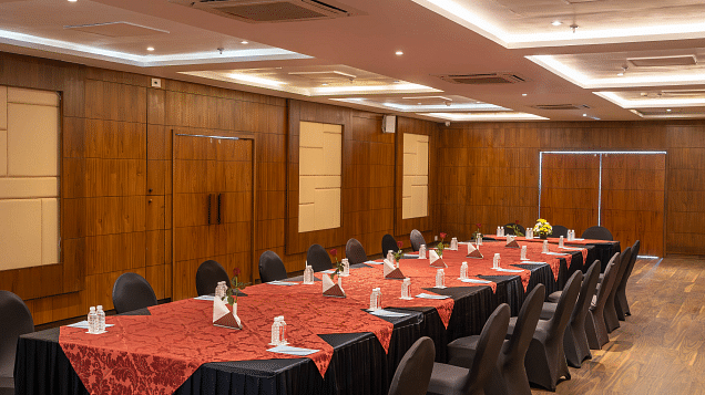 A conference room with a long table set for a meeting.- Bamboo Saa Resort & Spa, Udaipur.