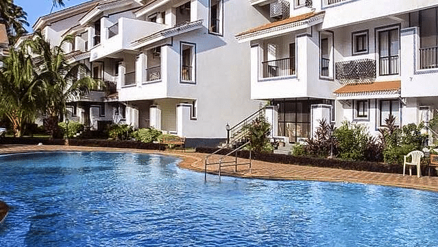 Casa Legend Villa & Serviced Apartments, Goa Goa Pool with Studio in the background