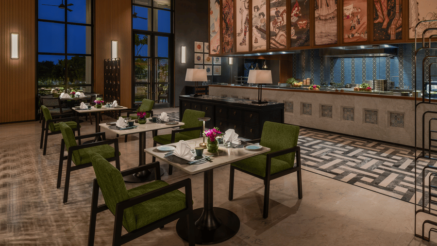 Chin Chin restaurant showcasing a live kitchen counter with dining tables at The Residency Signature Madurai.