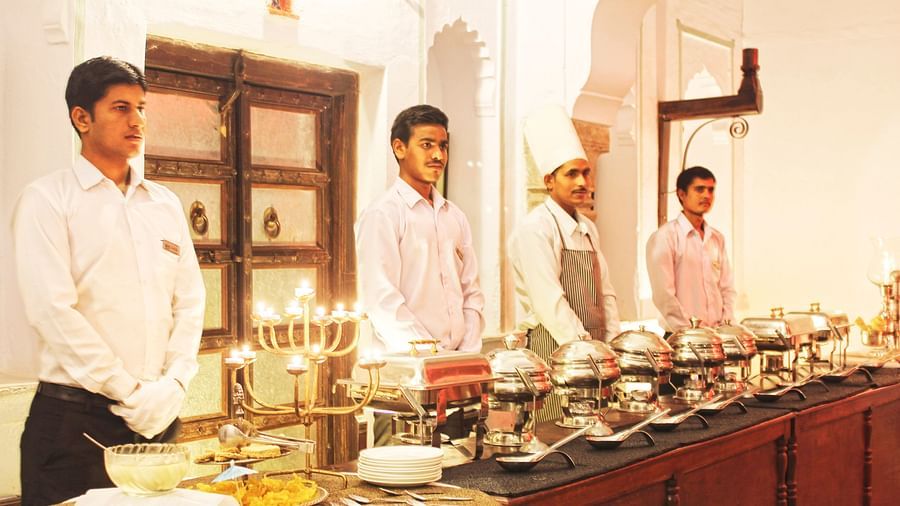 Staff prepare a lavish buffet spread at Fort Barli, showcasing the fort's hospitality and attention to detail.