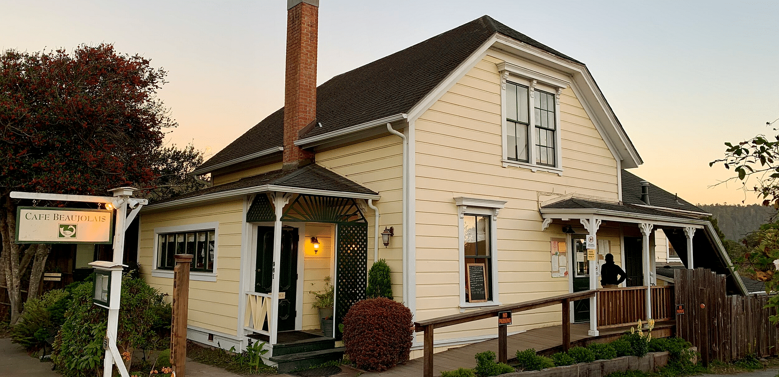 A two-story building with a sign reading 