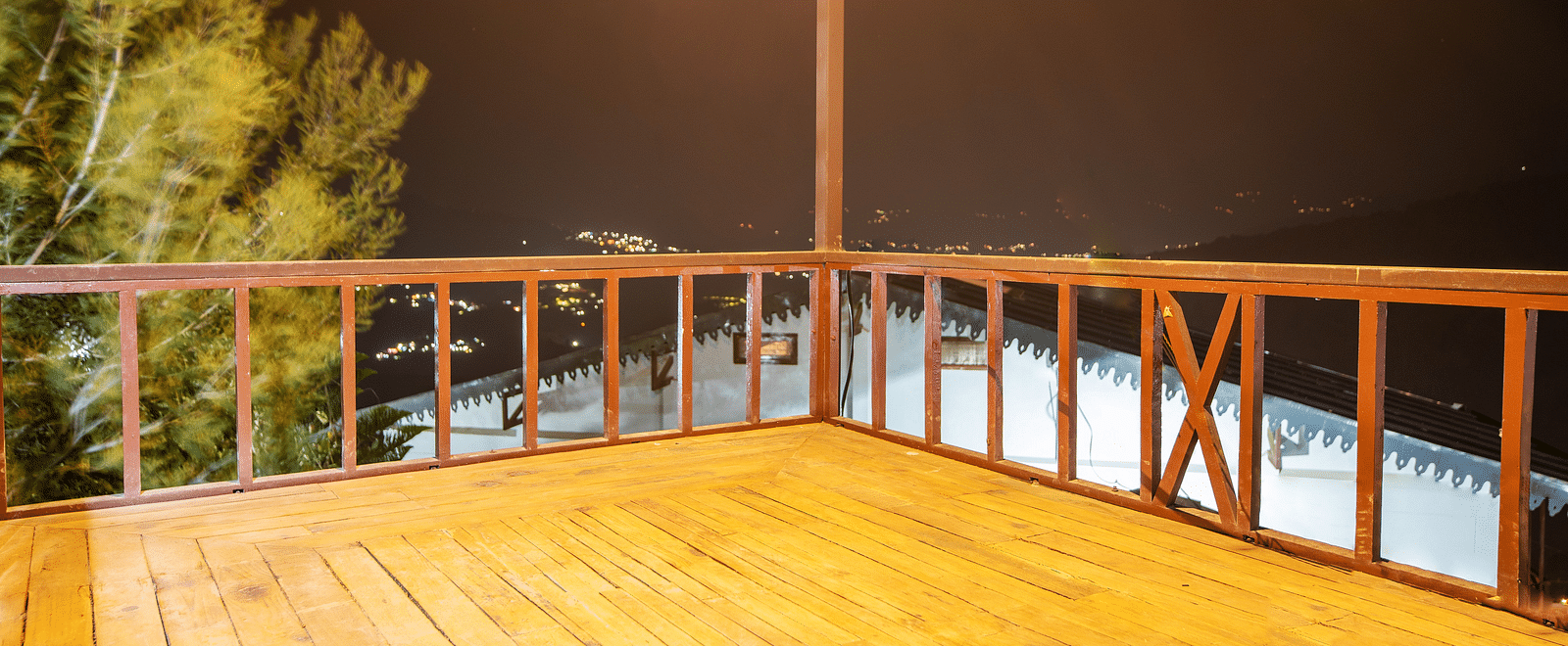 A scenic view from the homestay's rooftop, showcasing a tranquil forest under the starlit sky. - Blusalzz Homes The Himalayan Bungalow, Almora