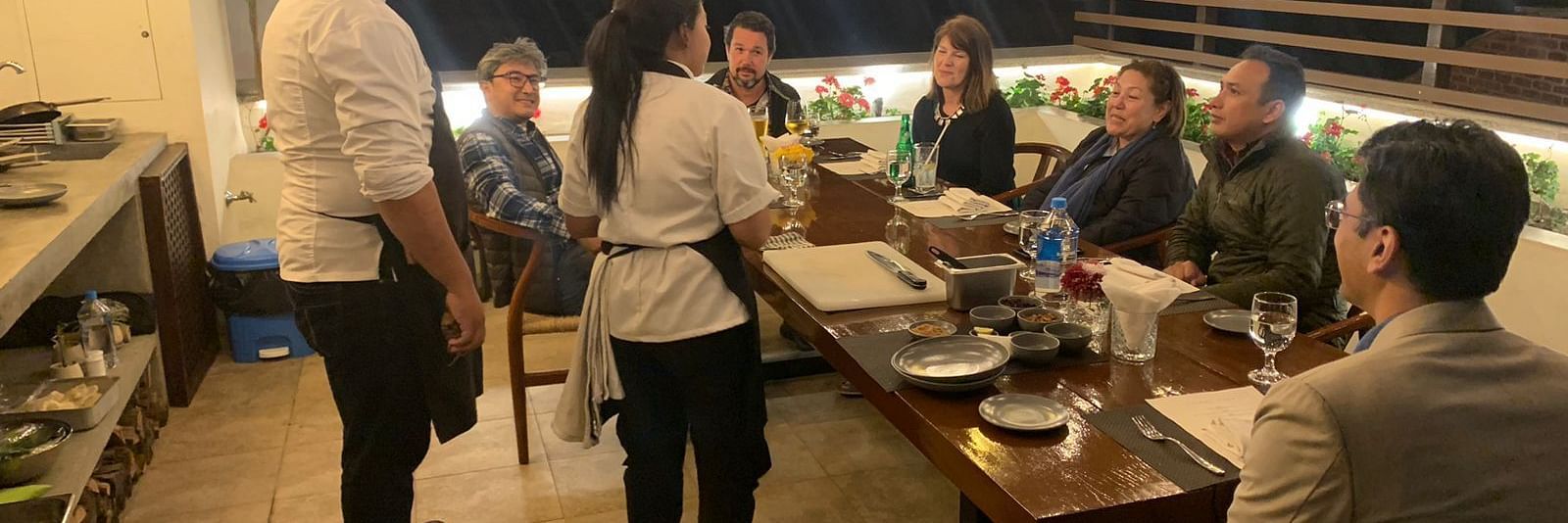 A group of people gathered for the chefs table dinner