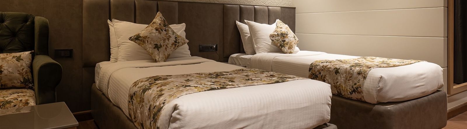 Twin beds inside the deluxe room - The Cindrella Hotel, Siliguri