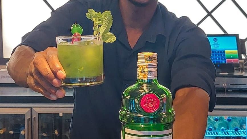 a waiter serving drinks