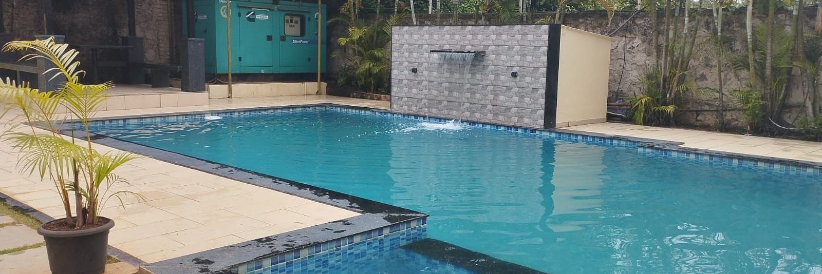 Outdoor pool area at Mountview Resort in Lonavala, featuring a gazebo by the side.